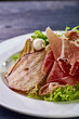 © alexmishchenko - Expensive Italian, Spanish, French salad for festive table. Snack from pear, mozzarella, jamon, greens, lettuce, sauce. Cuisine of France, Spain, Italy. Photo of food for menu, cookbook, culinary blog