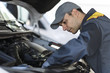 © Minerva Studio - Mechainc fixing a van engine