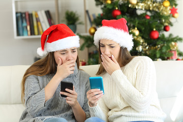 Wall Mural - Worried women reading bad news in christmas