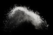 White powder or flour explosion isolated on black background  freeze stop motion object design