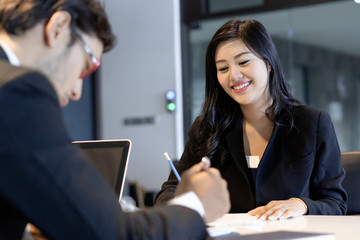 Wall Mural - Asian woman answering question interview during job application.