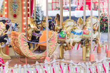 Colourful Carnival Horses On A Merry-go-round Carousel In The Amusement Park