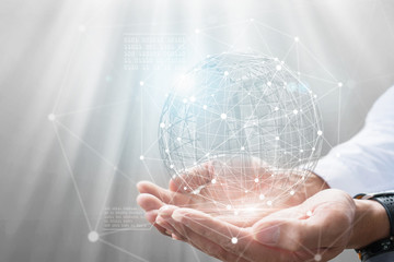 Businessman holding in hand with global connection concept.