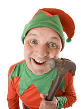 An Elf Holding A Hammer For Making Toys.