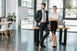 © LIGHTFIELD STUDIOS - young stylish business colleagues standing in office