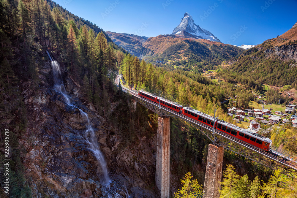 Zermatt, Switzerland. Image of Swiss Alps with Gornergrad tourist train, waterfall and Matterhorn in Valais region. - obrazy, fototapety, plakaty 