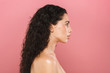 © Drobot Dean - Beautiful young woman with healthy skin posing isolated over pink background looking aside.