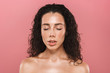 © Drobot Dean - Young woman with healthy skin posing isolated over pink background with eyes closed
