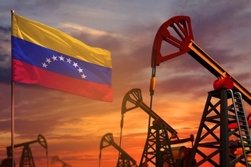 Wall Mural - Venezuela oil industry concept. Industrial illustration - Venezuela flag and oil wells with the red and blue sunset or sunrise sky background - 3D illustration
