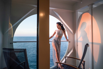 Sticker - woman relaxing on Cruise ship enjoying ocean view from balcony