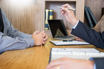 Wall Mural - young man explaining about his profile to business managers sitting in job Interview. listen to candidate answers Hiring employee, nervously clutched scolded by boss.