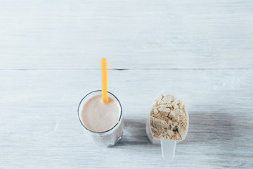 Wall Mural - Whey protein shake in glass with straw