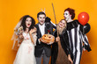 © Drobot Dean - Group of excited friends dressed in scary costumes