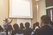 © PRASERT - Speaker giving a talk at business meeting. audience in the conference hall. Business and entrepreneurship. copy space on white board.