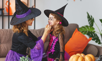 Wall Mural - happy family  getting ready for halloween make make-up