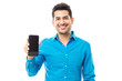 © AntonioDiaz - Attractive Male Smiling While Holding Smartphone