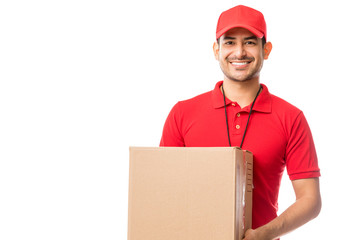 Wall Mural - Worker Smiling While Carrying Parcel Over White Background