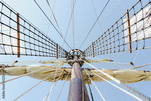 Fotografie, Obraz Mainmast and rope ladders to hold the sails of a sailboat.