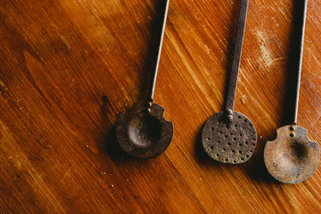 Old cast iron ladles and skimmers.