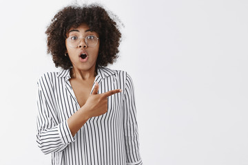 Wall Mural - waist-up shot of amazed stunned attractive woman holding breath being speechless from excitement and