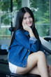 © tiniroma - Portrait of thai adult beautiful girl blue jeans relax and smile