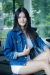 © tiniroma - Portrait of thai adult beautiful girl blue jeans relax and smile