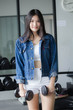 © tiniroma - Portrait of thai adult beautiful girl blue jeans in fitness relax and smile