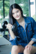© tiniroma - Portrait of thai adult beautiful girl blue jeans in fitness relax and smile