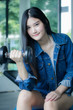© tiniroma - Portrait of thai adult beautiful girl blue jeans in fitness relax and smile