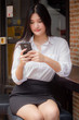 © tiniroma - Portrait of thai adult uniform office girl calling smart phone