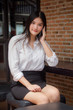 © tiniroma - Portrait of thai adult uniform office girl calling smart phone