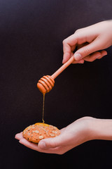 Wall Mural - Oatmeal cookies with honey and chocolate cookies on brown wooden table. Food, holiday, cooking, baking background. Concept of home and healthy eating.