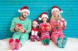 © Sunny studio - Happy family having fun at Christmas time