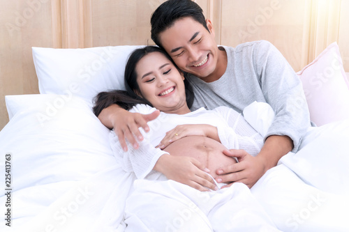 Husband Embracing His Wife S Belly On White Bed With Love