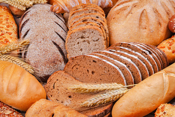 Wall Mural - fresh bread and wheat on the table. food concept