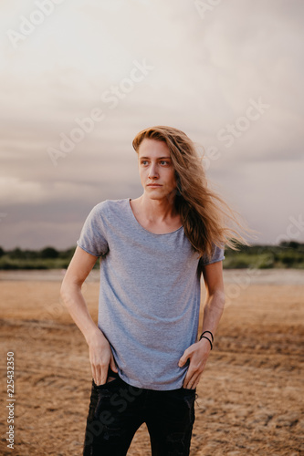 Attractive Young Male Model With Man Bun And Long Blonde Hair