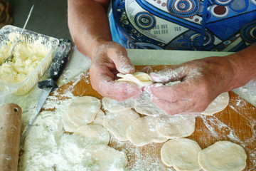 Wall Mural - Preparation of dumplings Vareniki with cottage cheese. National dish Dough.