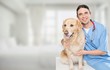 © BillionPhotos.com - Beautiful young veterinarian with a dog