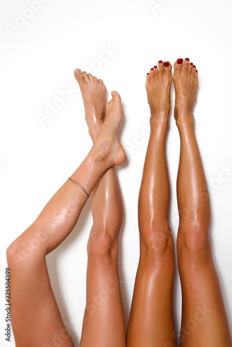 Two Beautiful Pairs Of Smooth Woman S Legs After Laser Hair