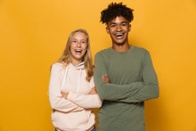 Photo Of Happy Students Man And Woman 16-18 With Dental Braces Laughing At Camera, Isolated Over Yellow Background