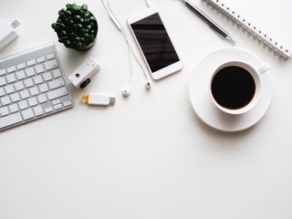 Poster - top view of office desk workspace with notebook, smartphone and gadget on white background with copy space, graphic designer, Creative Designer concept.