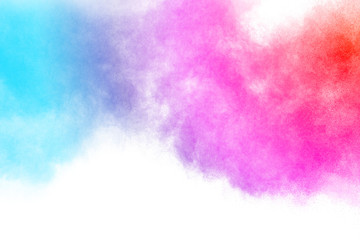 Wall Mural - multicolored powder explosion on white background.