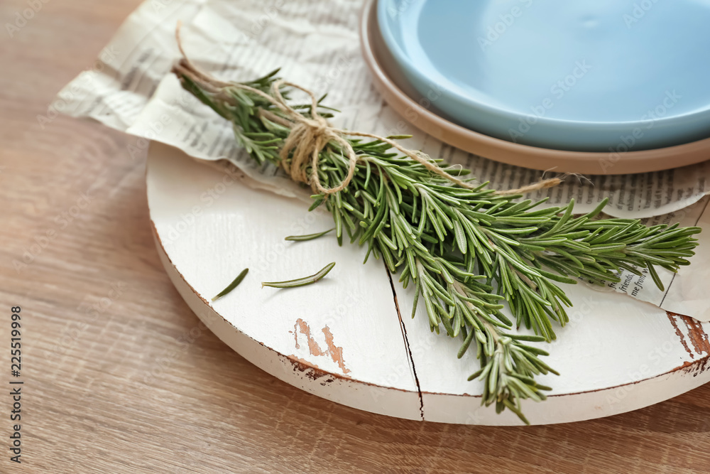 Fresh rosemary on white wooden board