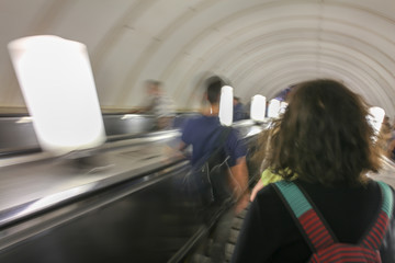 People on the escalator in the metro