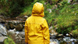 Back of a Small Person wearing a Yellow Rain Coat