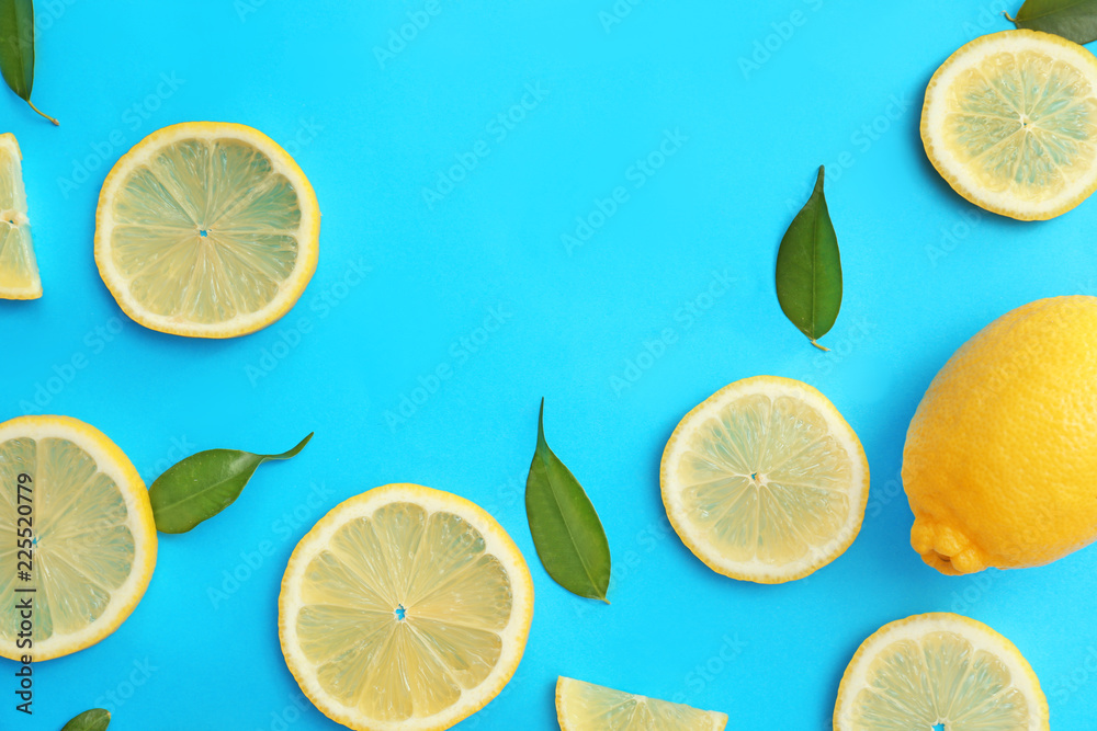 Flat lay composition with lemon slices on color background