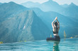 © 220 Selfmade studio - Beautiful Attractive Asian woman practice yoga Lotus pose on the pool above the Mountain peak in the morning in front of beautiful nature views in SAPA vietnam,Feel so comfortable and relax in holiday