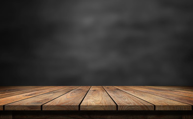 wooden table with dark blurred background.