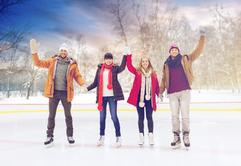 Sticker - people, friendship and leisure concept - happy friends waving hands on skating rink outdoors