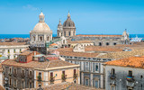 Fototapeta Miasto - Rooftop view in Catania, with the domes of the Church of the Badia di Sant'Agata and the Sant'Agata Cathedral. Sicily, Italy.